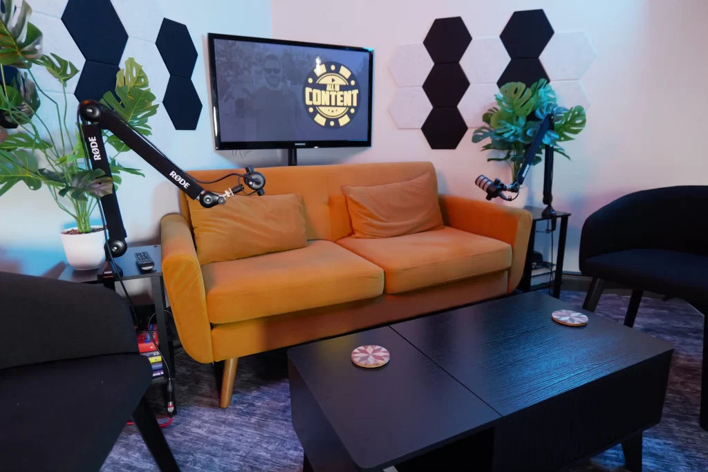 Lounge set with an orange sofa at All In Content Studio
